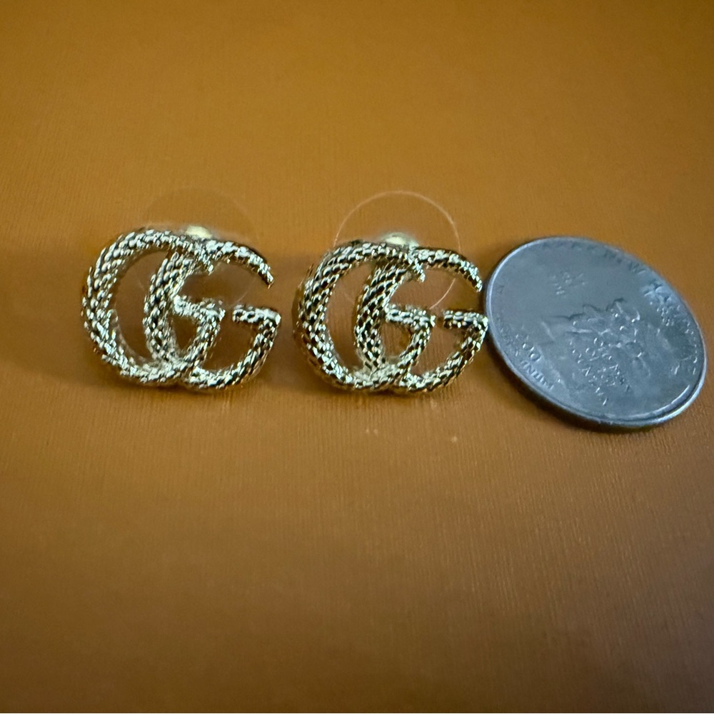 New Gucci Gold tone
Logo Earrings studs